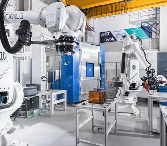 two large industrial robotic arms in a university laboratory